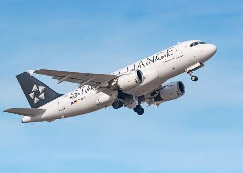 airplane climbing into the sky