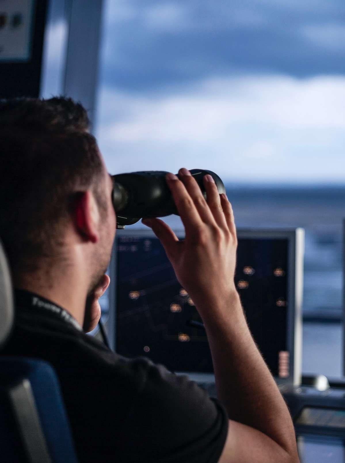air traffic controller using binoculars air traffic controller using binoculars